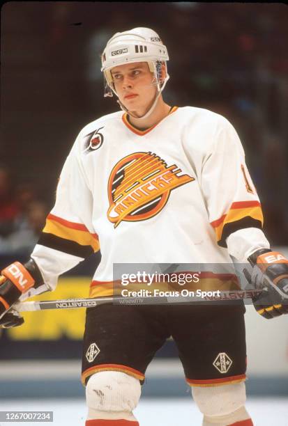 Pavel Bure of the Vancouver Canucks looks on against the New Jersey Devils during an NHL Hockey game circa 1991 at the Pacifica Coliseum in...