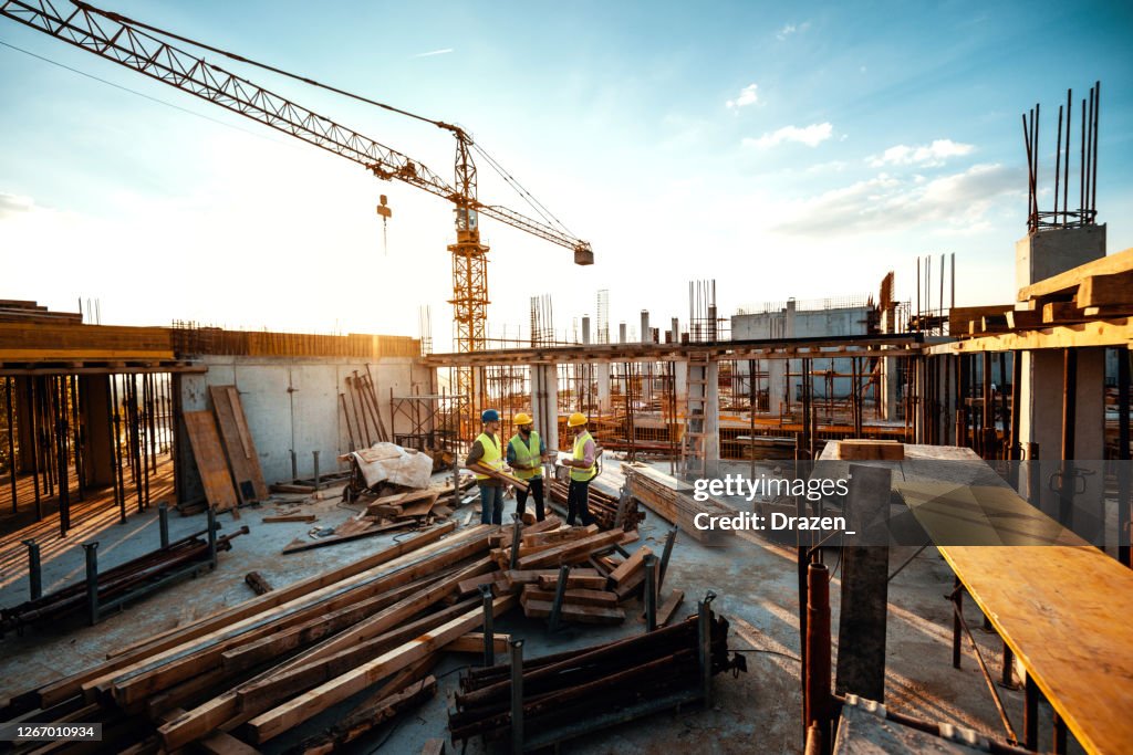 Experienced engineer explaining the problems in construction works - development after recession