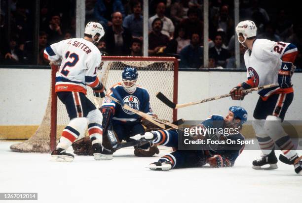 Andy Moog of the Edmonton Oilers defends his goal against the New York Islanders during the 1983 NHL Stanley Cup Finals at the Nassau Veterans...
