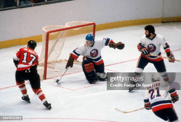 Billy Smith of the New York Islanders defends his goal against the Philadelphia Flyers during the 1980 NHL Stanley Cup Playoff circa 1980 at the...