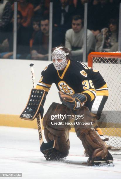 Gerry Cheevers of the Boston Bruins defends his goal against the New York Rangers during an NHL Hockey game circa 1978 at Madison Square Garden in...