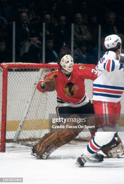 Tony Esposito of the Chicago Blackhawks defends his goal against the New York Rangers during an NHL Hockey game circa 1979 at Madison Square Garden...