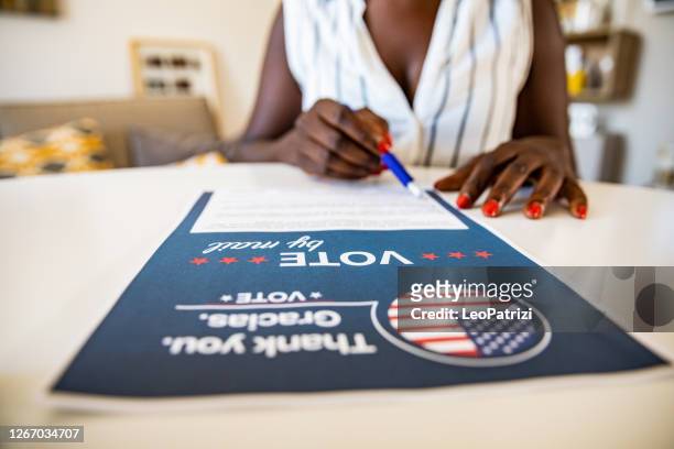 woman voting from home for the usa election - democratic women of the house stock pictures, royalty-free photos & images