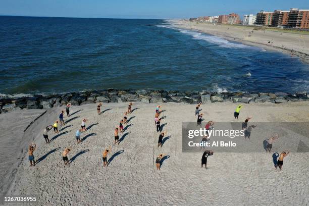 An aerial view of members of the Jetty Fitness Club training with what they call a "Life Outside the Box" workout led by fitness instructor Alexa...