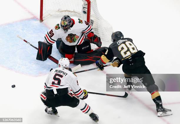 Corey Crawford of the Chicago Blackhawks makes the first period save on William Carrier of the Vegas Golden Knights in Game Five of the Western...