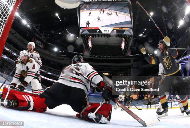 Mark Stone of the Vegas Golden Knights celebrates after teammate Max Pacioretty scores on goaltender Corey Crawford of the Chicago Blackhawks during...