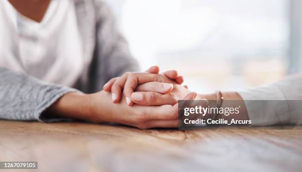 i'm going to help you get through this - holding hands stock pictures, royalty-free photos & images