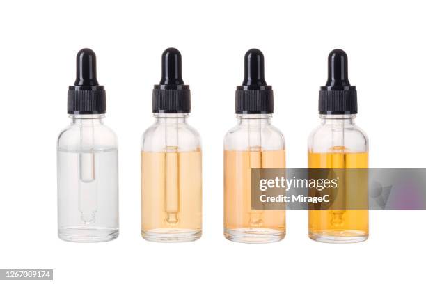 essential oil bottles - aromatherapy stock pictures, royalty-free photos & images