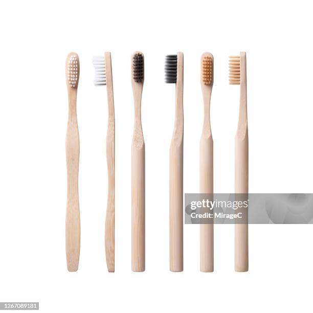 plastic free wooden and bamboo toothbrushes - bambù materiale foto e immagini stock