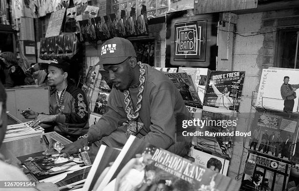 Rappers Ice-T and Big Daddy Kane signs autographs and greets fans at Barney's One Stop in Chicago, Illinois in November 1988.