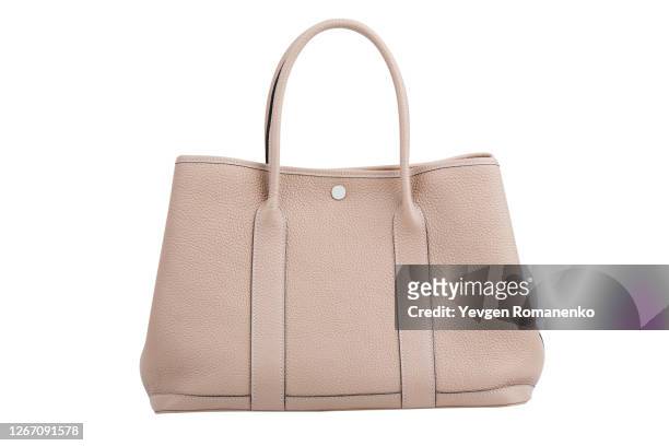 beige leather handbag isolated on white background - cream colored purse photos et images de collection
