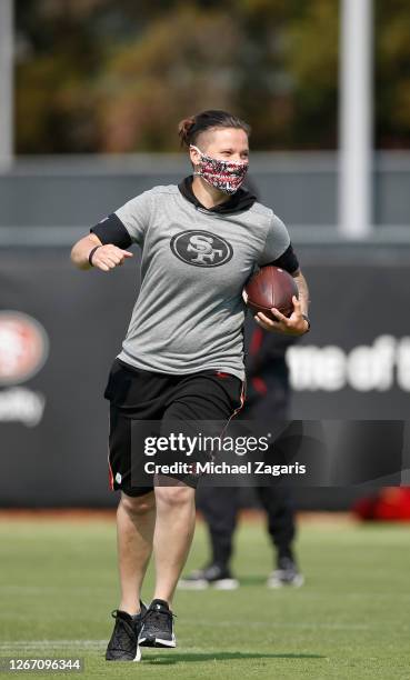 Offensive Assistant Coach Katie Sowers of the San Francisco 49ers runs during training camp at the SAP Performance Facility on August 18, 2020 in...