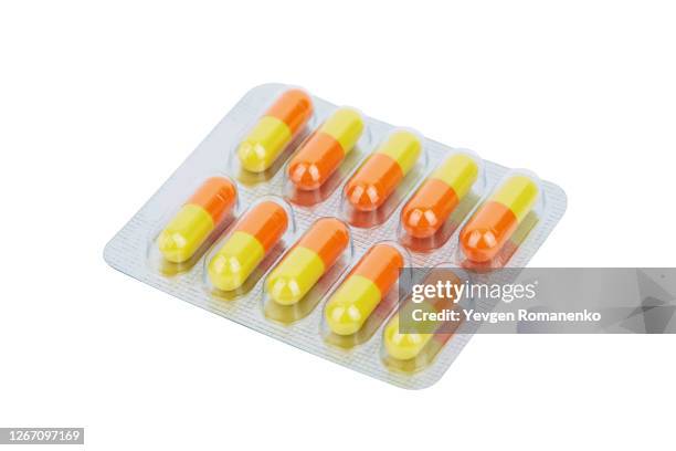 pills in a blister pack isolated on white background - blister stock pictures, royalty-free photos & images