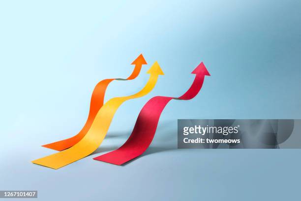 abstract financial growth coloured bar with arrow head moving upwrads still life. - abstract money stock pictures, royalty-free photos & images
