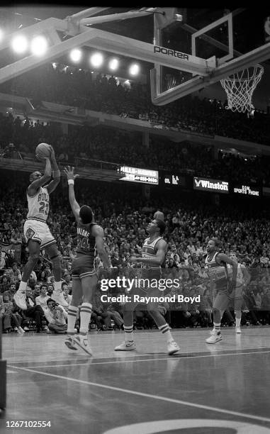 Chicago Bulls guard Michael Jordan goes up for a jump shot during a game against the Washington Bullets at Chicago Stadium in Chicago, Illinois in...