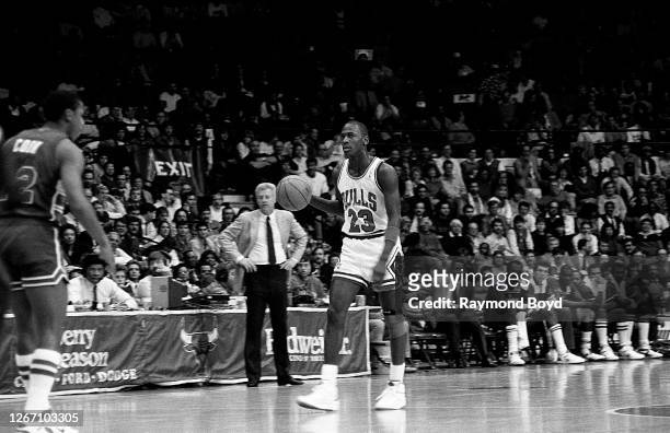 Chicago Bulls guard Michael Jordan brings the ball up the court during a game against the Washington Bullets at Chicago Stadium in Chicago, Illinois...