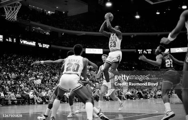 Chicago Bulls guard Michael Jordan goes up for a jump shot during a game against the Indiana Pacers at Chicago Stadium in Chicago, Illinois in...
