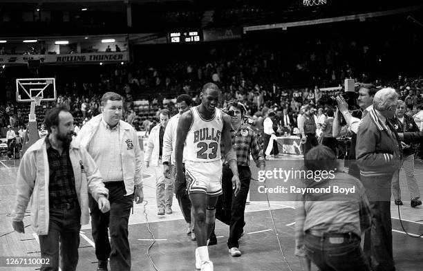 Chicago Bulls guard Michael Jordan walks off the court after a victory against the New Jersey Nets at Chicago Stadium in Chicago, Illinois in January...