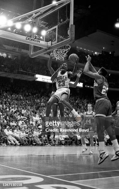 Chicago Bulls guard Michael Jordan goes up for a reverse layup during a game against the Cleveland Cavaliers at Chicago Stadium in Chicago, Illinois...