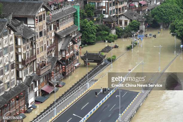 An aerial view of a flooded street along the banks of the Jialing River after heavy rainfalls on August 19, 2020 in Chongqing, China.