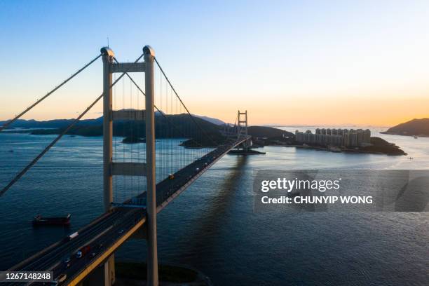 drone view of hong kong tsing ma bridge in sunset - lantau imagens e fotografias de stock