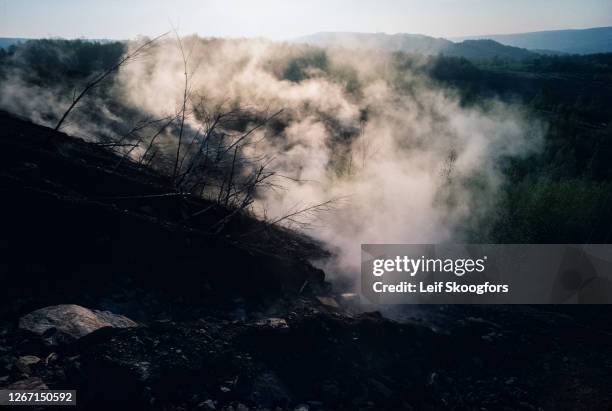 View of smoke and toxic fumes from an underground coal seam fire, Centralia, Pennsylvania, July 1992. The town was largely abandoned due to the fire...