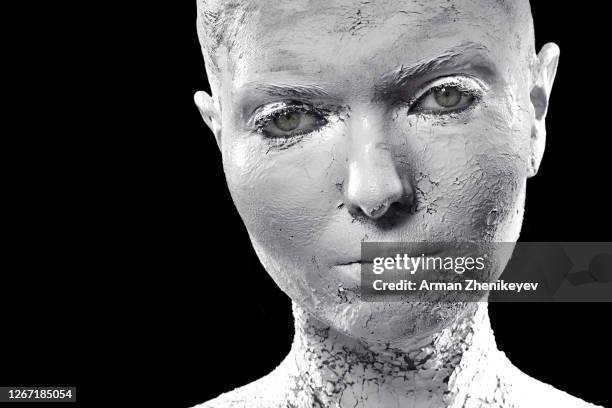 woman covered in plaster - expensive statue stockfoto's en -beelden