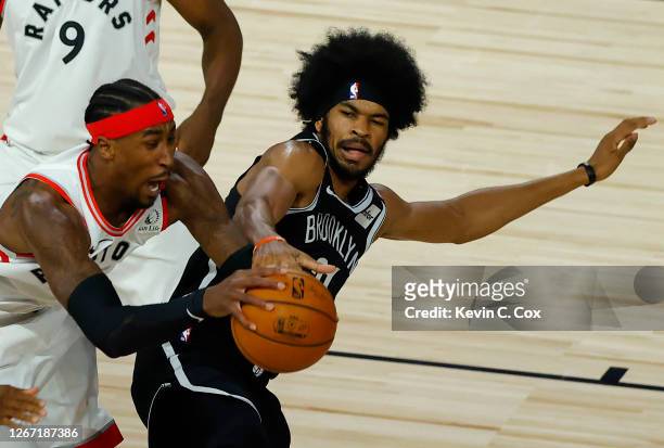 Jarrett Allen of the Brooklyn Nets is called for a loose ball foul against Rondae Hollis-Jefferson of the Toronto Raptors goes during the second...