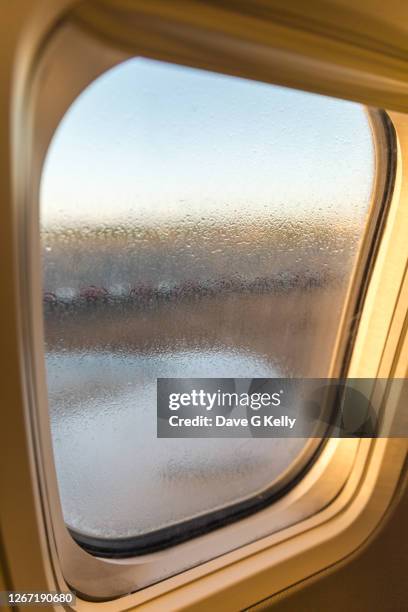 condensation on a plane window - the dublin airport fotografías e imágenes de stock