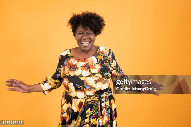 informal portrait of early 60s black woman full of vitality - senior dancing stock pictures, royalty-free photos & images
