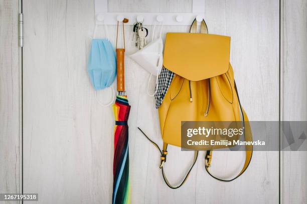 protective face masks hanging on coat hanger - computer key stock pictures, royalty-free photos & images