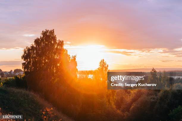 sunset over the volga river - volga stock-fotos und bilder