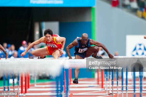 Allen Johnson of the United States of America and Xiang Liu of China during the final of the men's 110m hurdles at The 9th IAAF World Athletics...