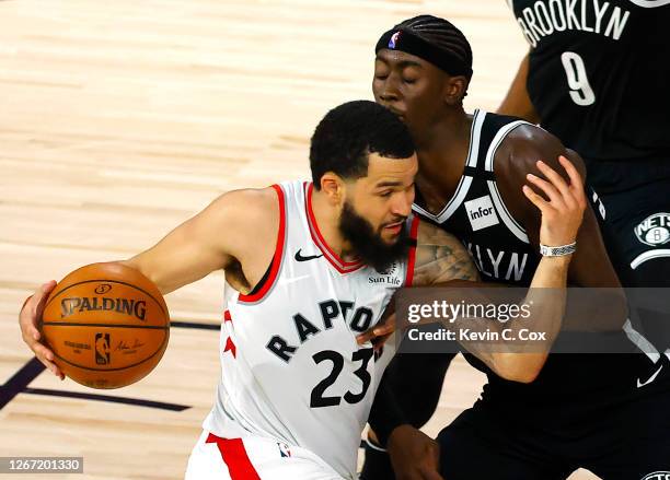 Fred VanVleet of the Toronto Raptors drives against Caris LeVert of the Brooklyn Nets during the fourth quarter in Game Two of the Eastern Conference...