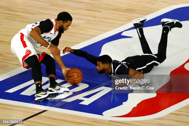 Fred VanVleet of the Toronto Raptors steals the ball from Garrett Temple of the Brooklyn Nets during the fourth quarter in Game Two of the Eastern...