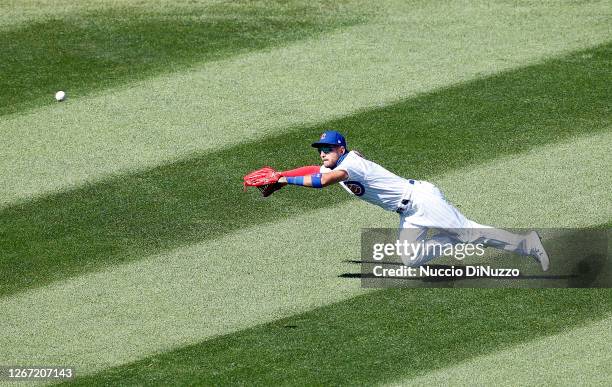 Albert Almora Jr. #5 of the Chicago Cubs misses a double hit by Brad Miller of the St. Louis Cardinals during the sixth inning of Game One of a...