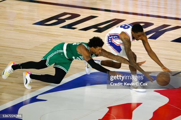 Marcus Smart of the Boston Celtics knocks the ball loose form Shake Milton of the Philadelphia 76ers during the second quarter in Game Two of the...