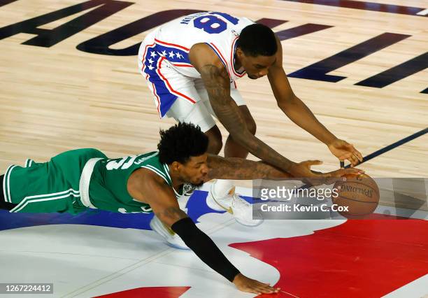 Marcus Smart of the Boston Celtics knocks the ball loose from Shake Milton of the Philadelphia 76ers during the second quarter in Game Two of the...