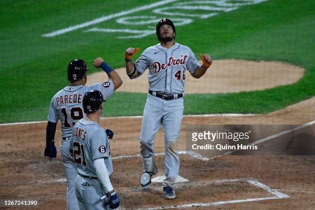 Jeimer Candelario of the Detroit Tigers celebrates with Isaac Paredes and JaCoby Jones of the Detroit Tigers after his three-run home run in the...