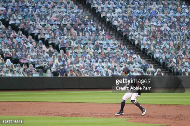 Sam Haggerty of the Seattle Mariners looks on from second base in the second inning after hitting a single earlier in the inning to record his first...