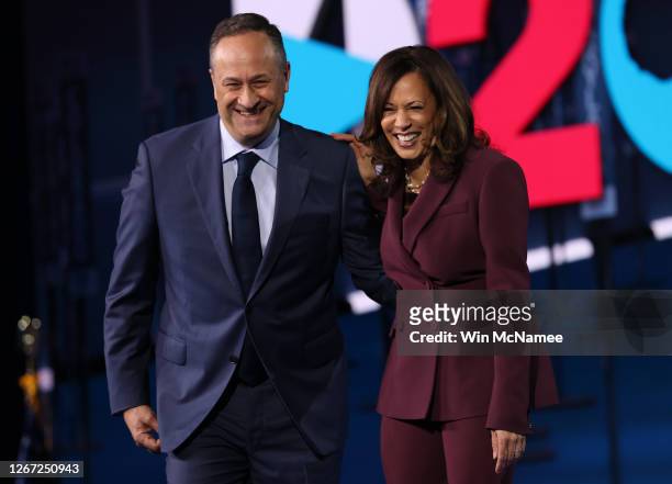 Democratic vice presidential nominee U.S. Sen. Kamala Harris and her husband Douglas Emhoff appear on stage after Harris delivered her acceptance...