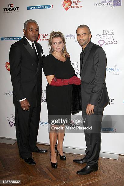 Tony Parker Senior, Pamela Firestone and Tony Parker attend the 'ParCoeur Gala' at Mairie de Paris on September 26, 2011 in Paris, France.