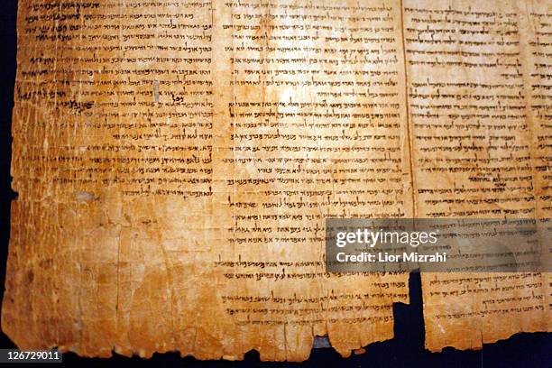 Part of the Isaiah Scroll, one of the Dead Sea Scrolls, is seen inside the vault of the Shrine of the Book building at the Israel Museum on September...