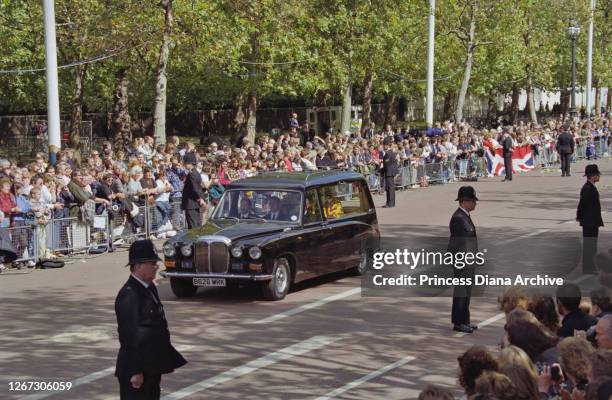 Mourners line the route of the hearse carrying the coffin of Diana, Princess of Wales , draped with the Royal Standard, en route to the Princess's...