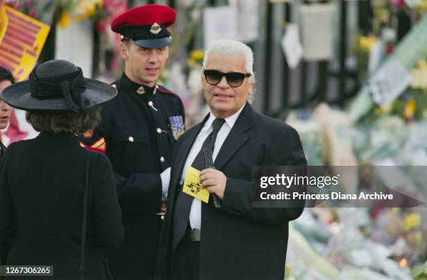 British-American journalist and editor Anna Wintour and German fashion designer Karl Lagerfeld among the mourners attending the funeral service for...