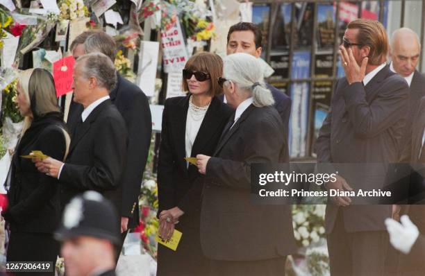 British-American journalist and editor Anna Wintour and German fashion designer Karl Lagerfeld among the mourners attending the funeral service for...