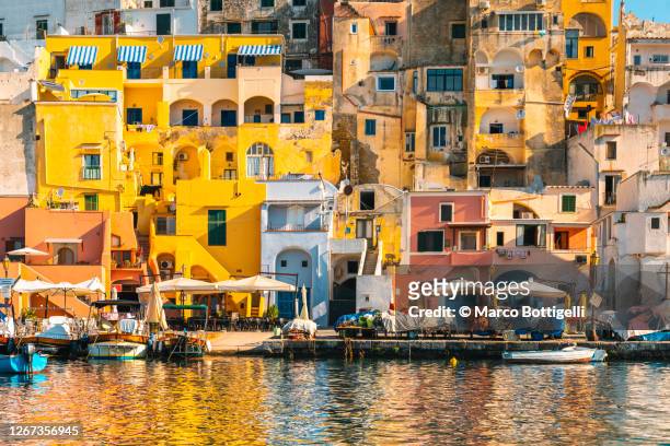the colorful houses in la corricella district, procida island, italy - mediterranean sea ストックフォトと画像
