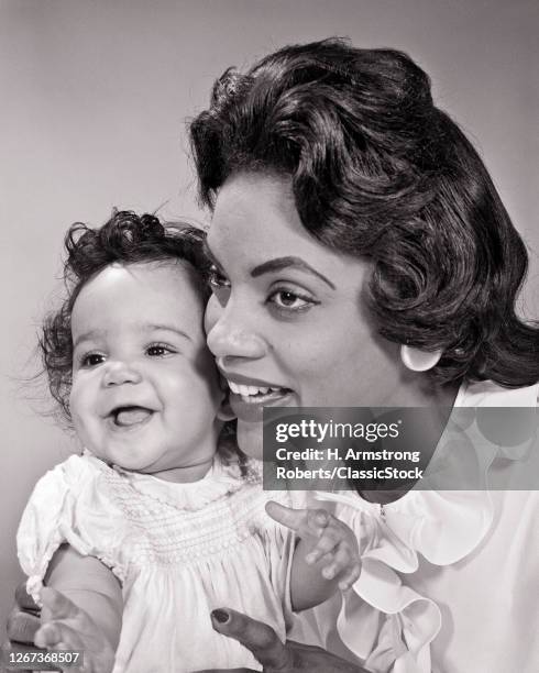 1960s Smiling African-American Woman Mother Posing Cheek To Cheek With Her Laughing Baby Girl Daughter