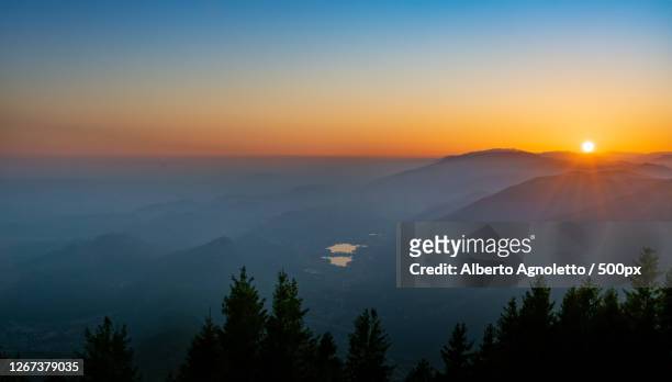 landscape of valley in mountain with lakes at sunset, fregona, veneto, italy - fregona stock pictures, royalty-free photos & images