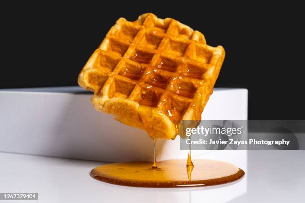 waffle with honey - syrup stock pictures, royalty-free photos & images